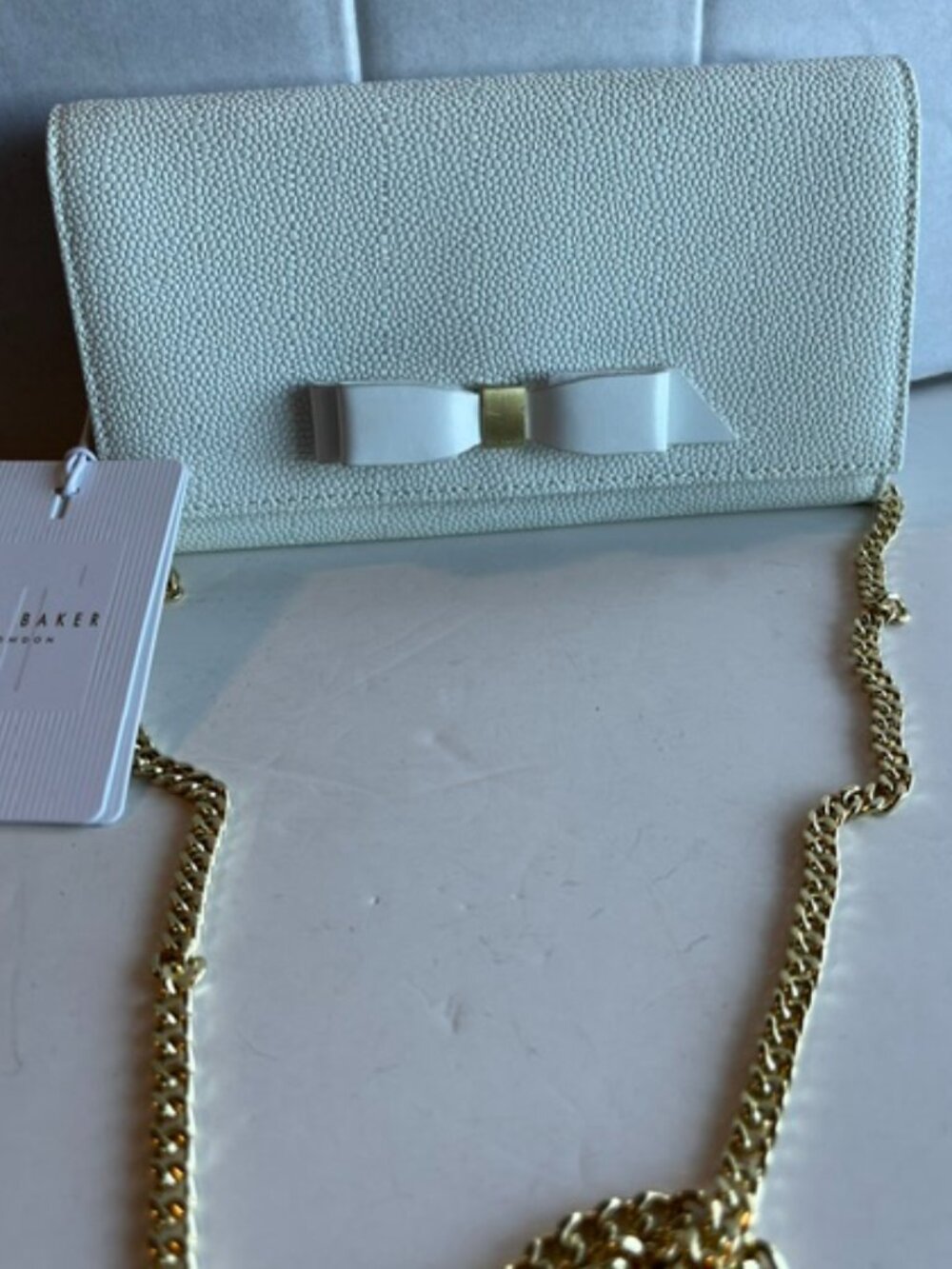 Ted Baker pebbled leather wristlet.